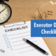Executor checklist with pen, clock, and family figurines, representing executor duties after a loved one’s death.